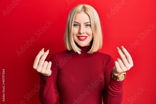 Wallpaper Mural Young blonde woman wearing casual clothes doing money gesture with hands, asking for salary payment, millionaire business Torontodigital.ca
