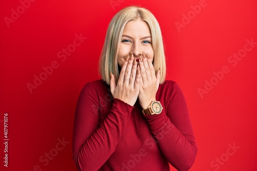 фотографія Young blonde woman wearing casual clothes laughing and embarrassed giggle coveri