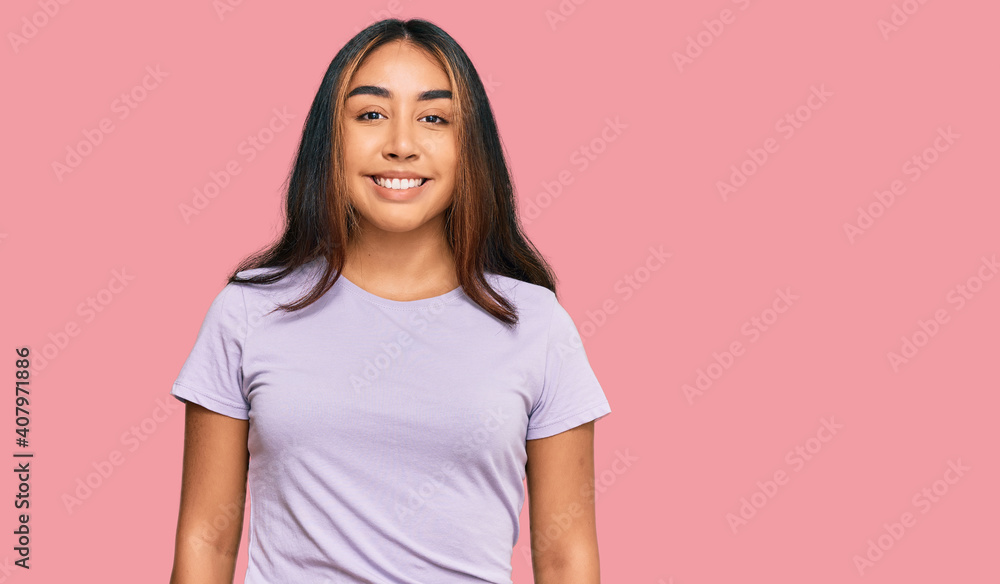 Young latin woman wearing casual clothes with a happy and cool smile on face. lucky person. Young latin woman wearing casual clothes with a happy and cool smile on face. lucky person.