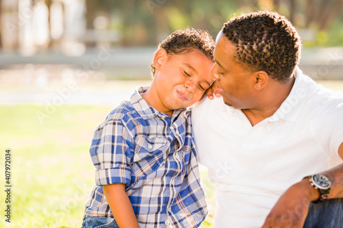 Happy African American Father and Mixed Race Son Playing At The Park