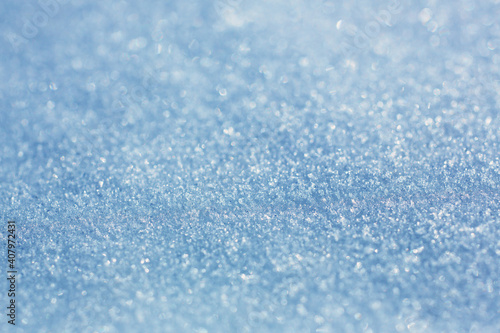 Close-up of snow texture in winter on the banks of a frozen river.