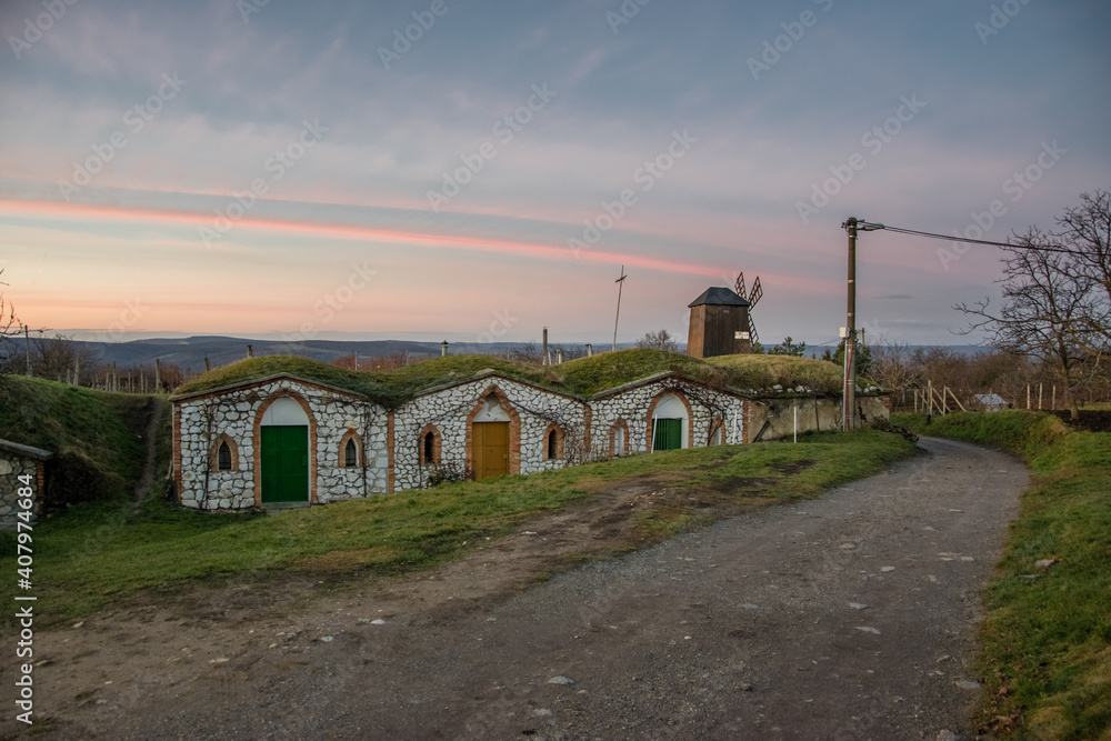 Tiny old stone wine cellars in Vrbice, South Moravia in the Czech Republic at sunset Tiny old stone wine cellars in Vrbice, South Moravia in the Czech Republic at sunset