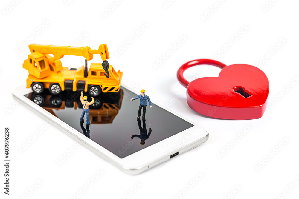 woman hand hold and touch screen smartphone or cellphone with heart lock shape isolated on white background. woman hand hold and touch screen smartphone or cellphone with heart lock shape isolated on white background.