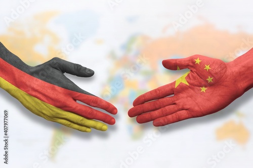 Photography China and Germany - Flag handshake symbolizing partnership and cooperation