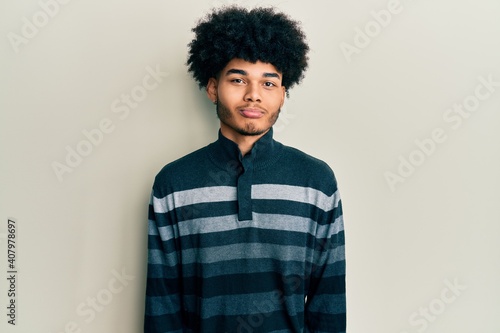 Young african american man with afro hair wearing casual clothes depressed and worry for distress, crying angry and afraid. sad expression. © Krakenimages.com