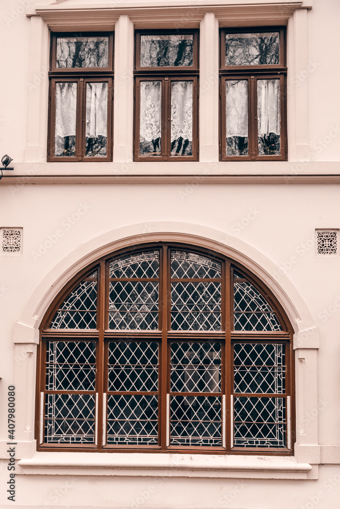 Big old oval window. Old wooden windows on an old building. Architecture in Germany 