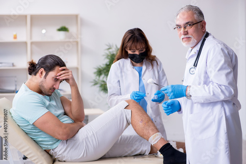 Young leg injured man in the hospital