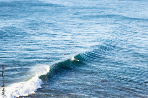 Photography Surfers waiting to catch the wave in the Pacific Ocean at Puertecillo spot in Chile