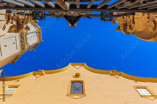 Low angle shot of a historical building in Villareal, Valencia, Spain with the view of the blue sky photo