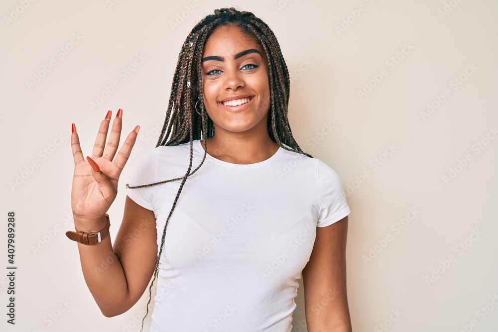 Young african american woman with braids wearing casual white tshirt showing and pointing up with fingers number four while smiling confident and happy. Young african american woman with braids wearing casual white tshirt showing and pointing up with fingers number four while smiling confident and happy.