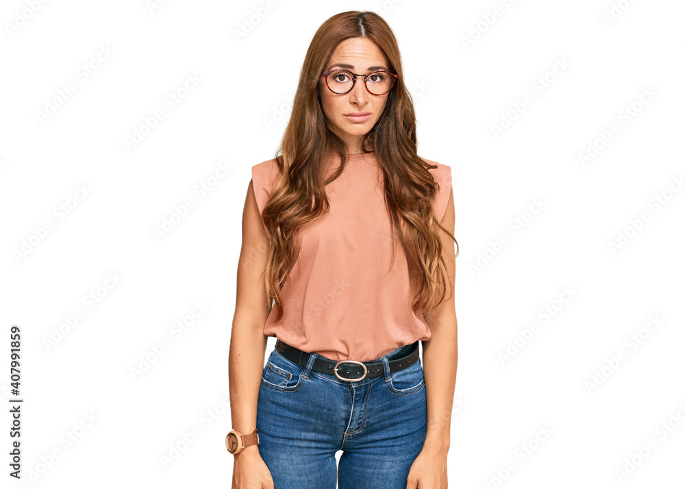 Young hispanic woman wearing casual clothes and glasses looking sleepy and tired, exhausted for fatigue and hangover, lazy eyes in the morning. Young hispanic woman wearing casual clothes and glasses looking sleepy and tired, exhausted for fatigue and hangover, lazy eyes in the morning.