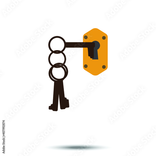 One of Three key from dark gold keychain hanging in keyhole in white background