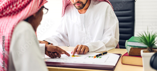 Fotografie Successful of two arab  business people working with laptop computer