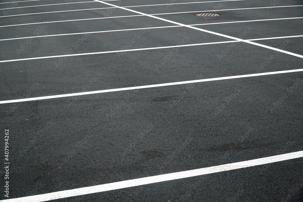 new paved parking lot with new painted strip lines
