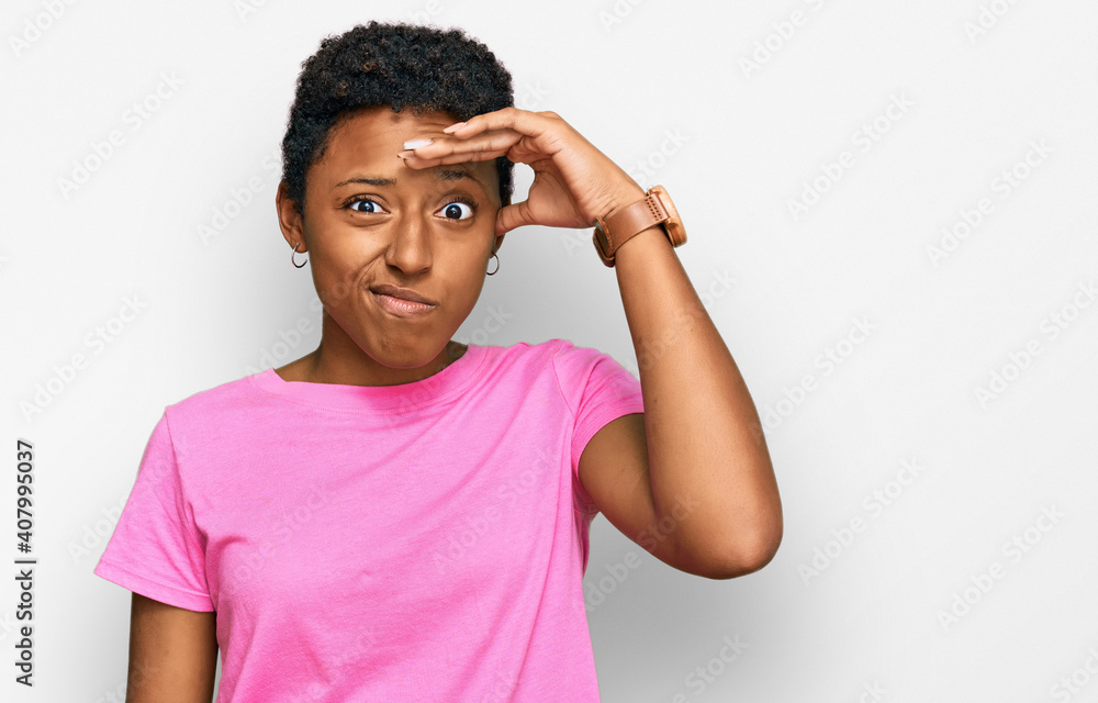 Young african american woman wearing casual clothes worried and stressed about a problem with hand on forehead, nervous and anxious for crisis Young african american woman wearing casual clothes worried and stressed about a problem with hand on forehead, nervous and anxious for crisis
