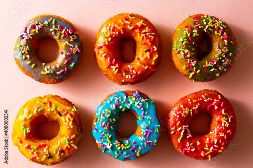 six colorful donuts with chocolate spray