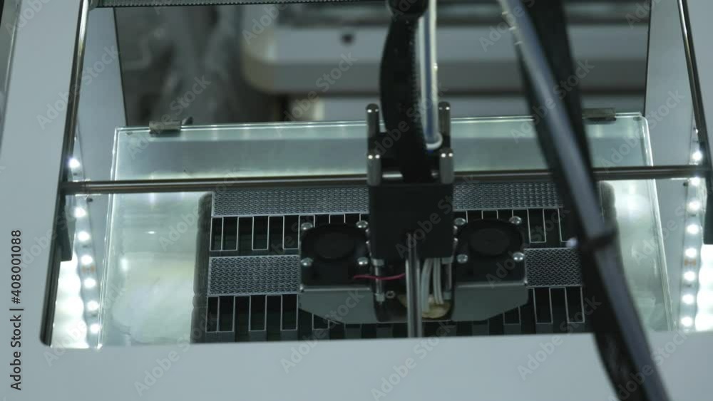 3D printer working. Fused deposition modeling, FDM. 3D printer printing an object from plastic. Automatic three dimensional 3d printer performs plastic. Progressive additive technology for 3d printing 3D printer working. Fused deposition modeling, FDM. 3D printer printing an object from plastic. Automatic three dimensional 3d printer performs plastic. Progressive additive technology for 3d printing