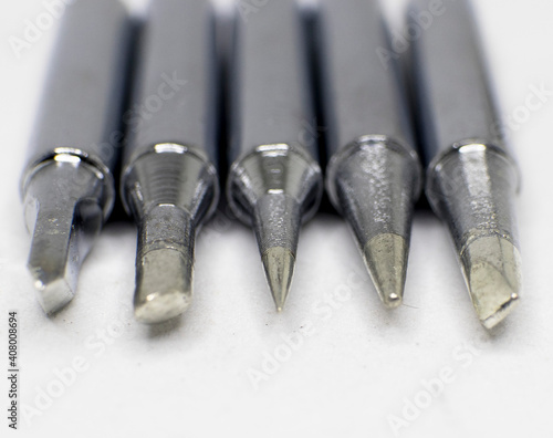 Soldering bits set closeup stainles steel white background photo