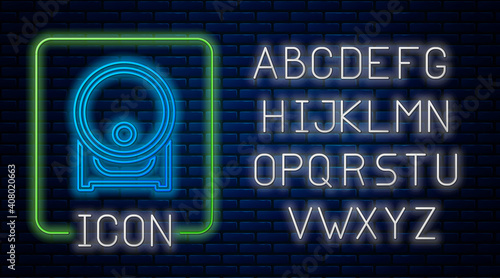 Glowing neon Wooden barrel on rack with stopcock icon isolated on brick wall background. Neon light alphabet. Vector.