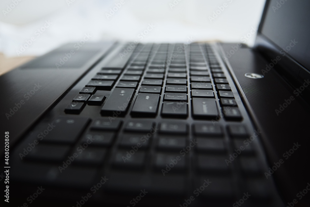 Laptop keyboard, close-up. Online working and education concept Laptop keyboard, close-up. Online working and education concept