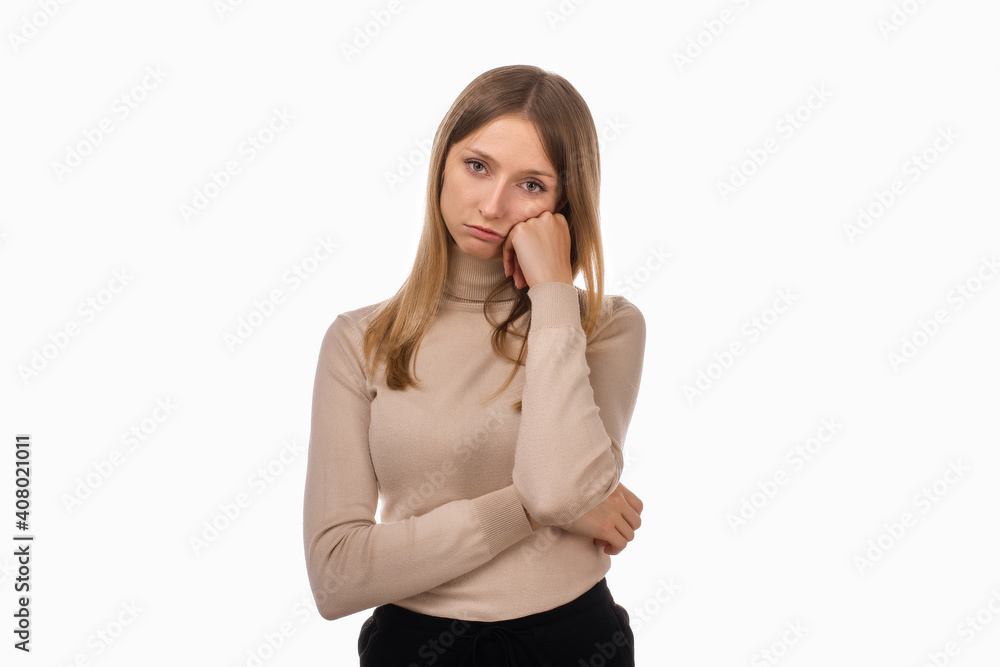 Bored young blond woman put head chin on hand having blank look. Girl suffering from idleness, lack of motivation Bored young blond woman put head chin on hand having blank look. Girl suffering from idleness, lack of motivation