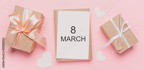 Gifts with note letter on isolated pink background, love and valentine concept with text 8 march