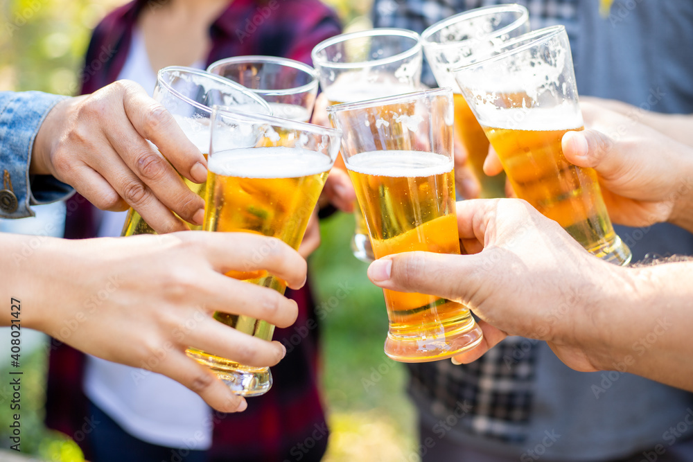 A group of friends cheered the beer and laughed happily on the holidays. A group of friends cheered the beer and laughed happily on the holidays.