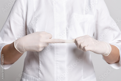 Cropped view of doctor in white latex gloves for protective virus. Protect yourself