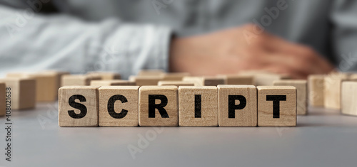 The word SCRIPT made from wooden cubes. Selective focus