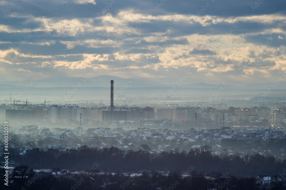 City from a height in smog on a winter day