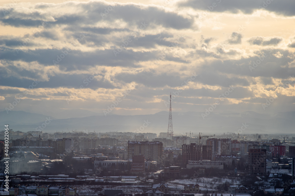 City from a height in smog on a winter day