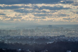 City from a height in smog on a winter day
