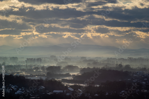 City from a height in smog on a winter day