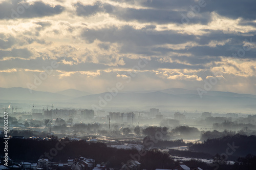 City from a height in smog on a winter day