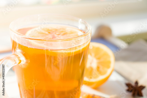 Autumn hot tea with lemon and spices