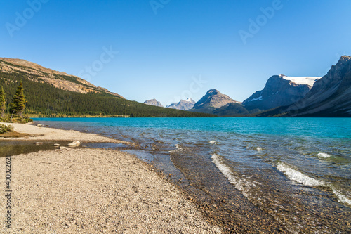 Bow Lake lakeshore in summer sunny day. Bow Glacier, Banff National Park, Canadian Rockies, Alberta, Canada.