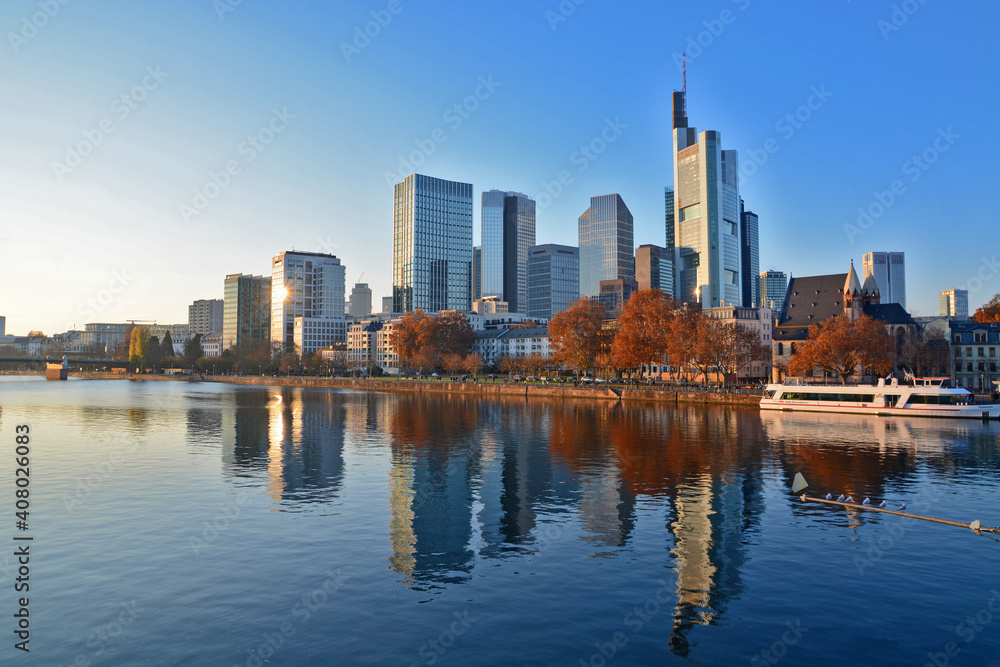 View on Frankfurts Skyline in autumn with a reflection of the buildings in the river, Frankfurt, Germany