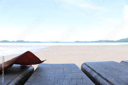 Empty old wooden vintage wooden in front of tidal current the sea, mountain and blue sky background. Ready for product display montage concept.