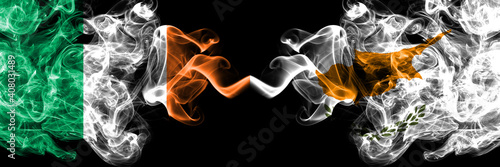 Republic of Ireland, Irish vs Cyprus, Cypriot smoky mystic flags placed side by side. Thick colored silky abstract smoke flags.