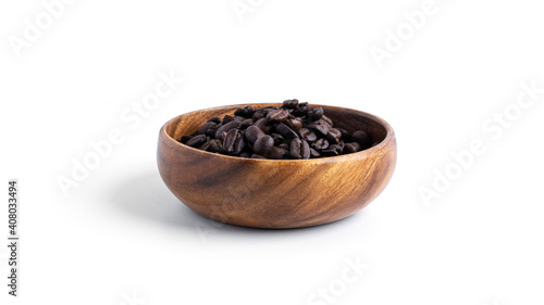 Coffee beans in wooden bowl isolated on a white background.
