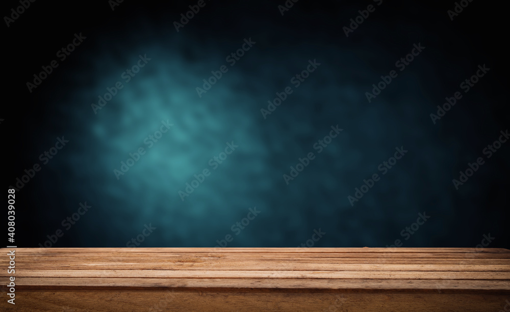background dark with direct light and worn old wooden table background dark with direct light and worn old wooden table