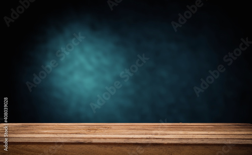 background dark with direct light and worn old wooden table