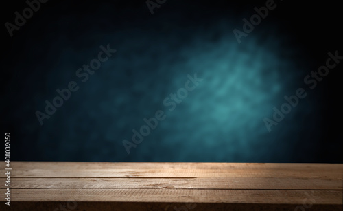 background dark with direct light and worn old wooden table