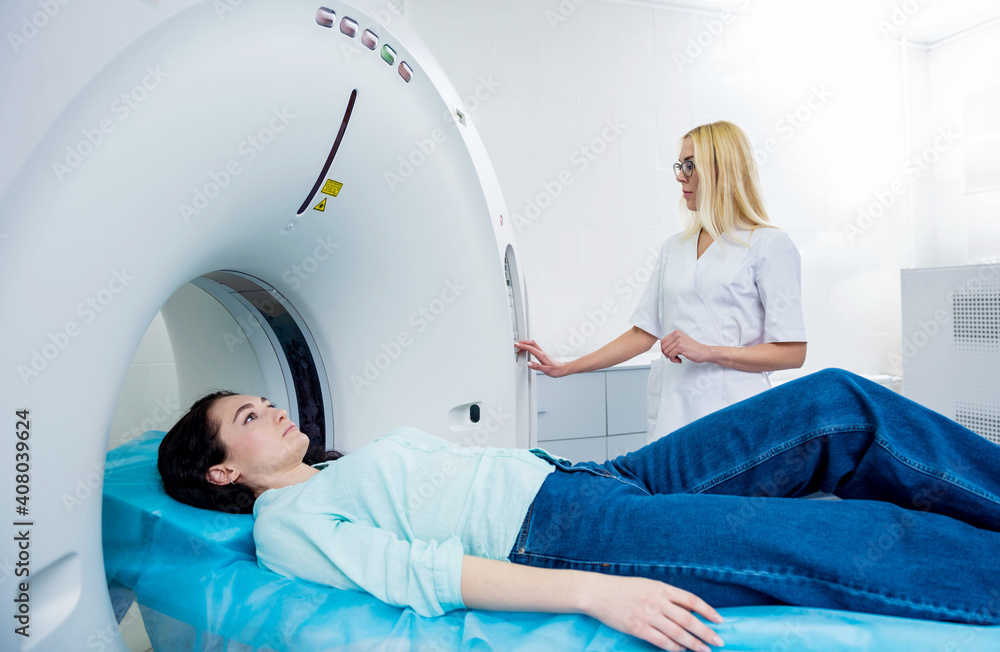 Doctor and patient in the room of computed tomography at hospital Doctor and patient in the room of computed tomography at hospital