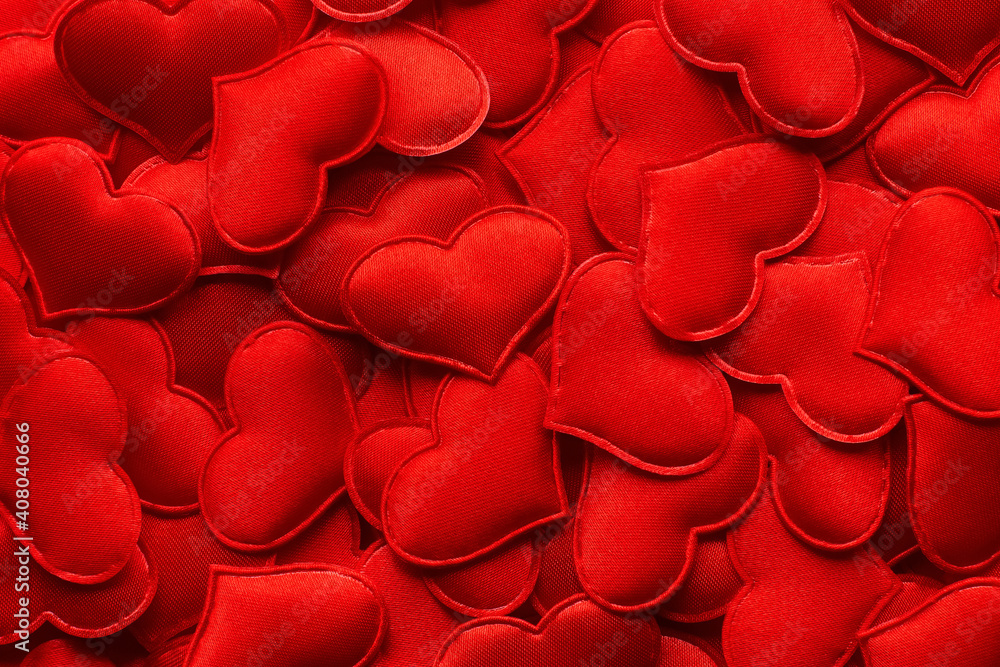 Festive romantic background from many red textile hearts close-up. Copy space.Valentine's Day Festive romantic background from many red textile hearts close-up. Copy space.Valentine's Day