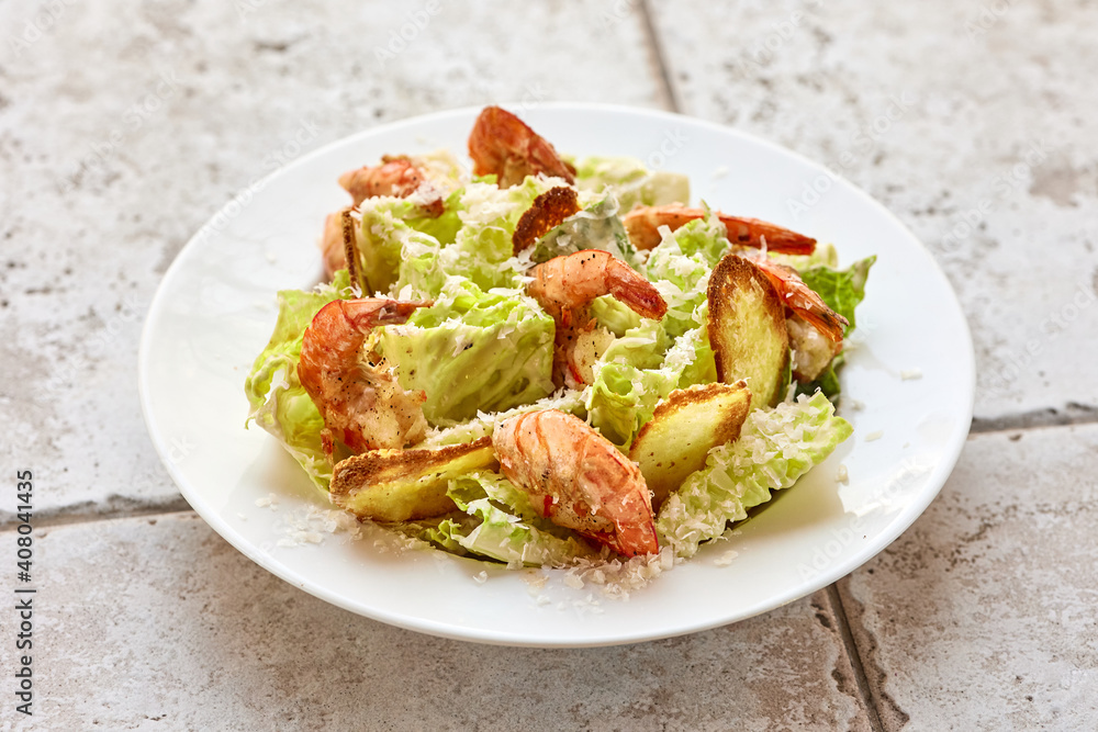 portion of cesar salad with grilled prawns portion of cesar salad with grilled prawns