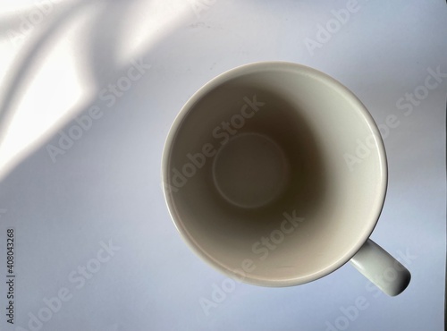 The picture of the coffee cup is lightly lit with a beautiful reflection.