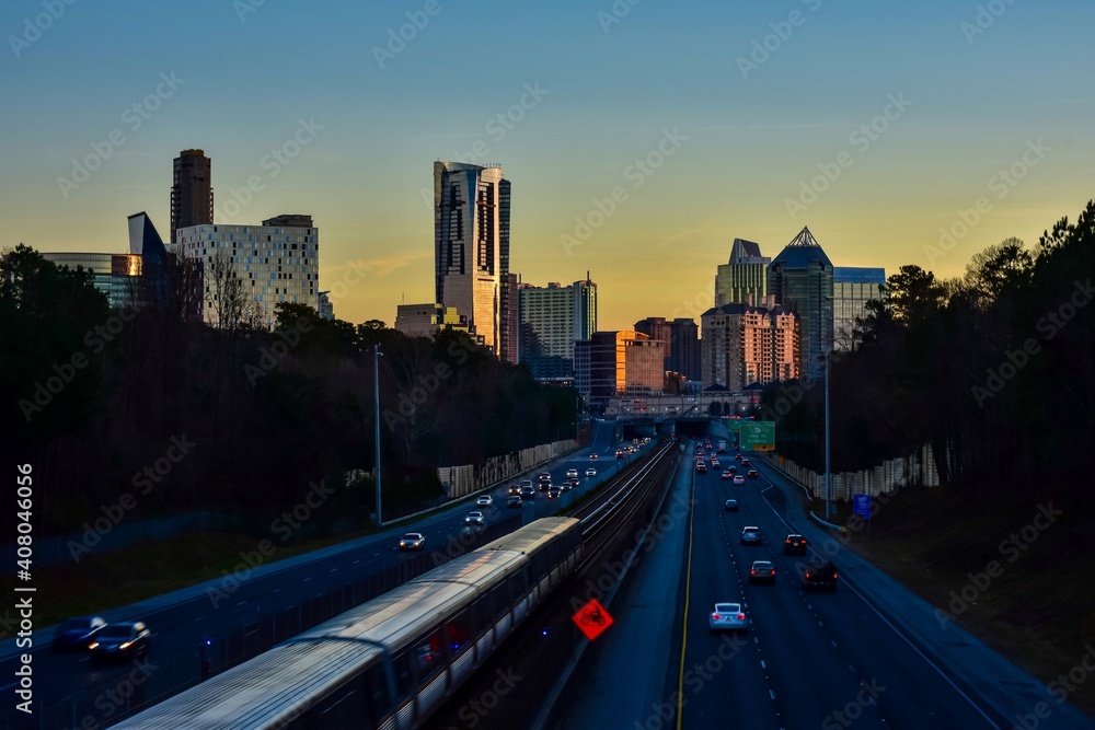 Buckhead Atlanta skyline with highway traffic during sunset 