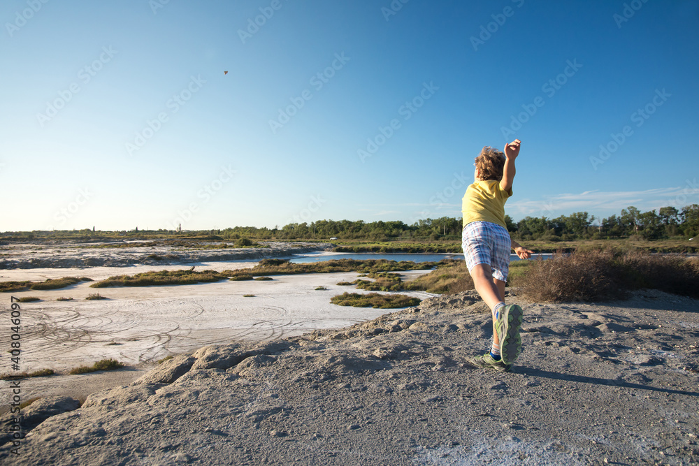 Child throws a stone