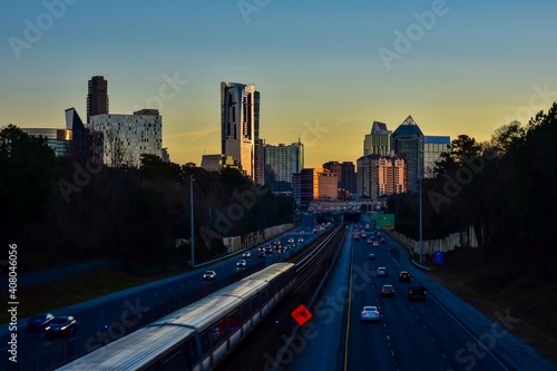 Buckhead Atlanta skyline with highway traffic during sunset 